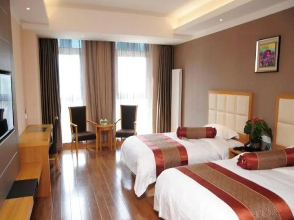 Bed in GreenTree Inn Shandong Taian Feicheng Xincheng Road Business Hotel