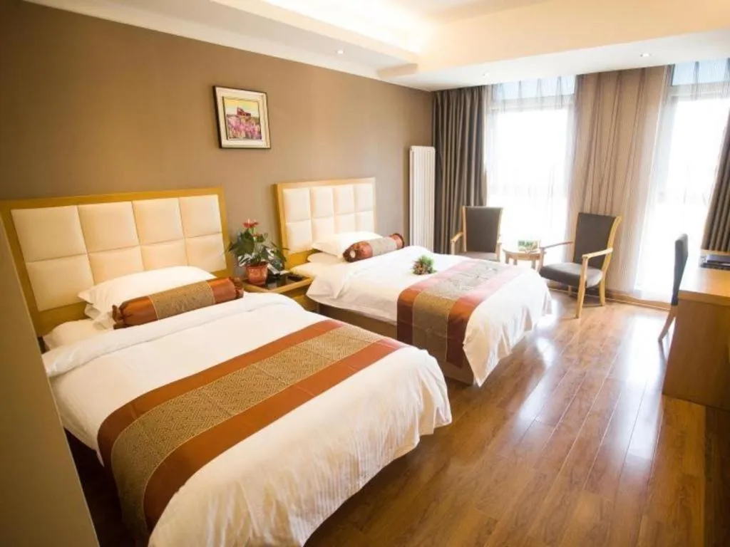 Bed in GreenTree Inn Shandong Taian Feicheng Xincheng Road Business Hotel