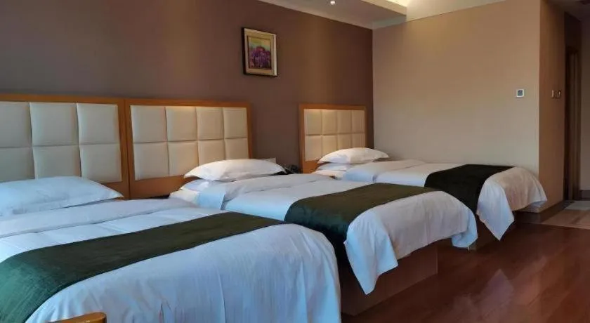 Bed in GreenTree Inn Shandong Taian Feicheng Xincheng Road Business Hotel