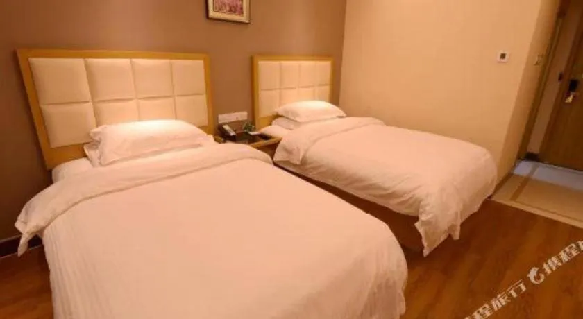Bed in GreenTree Inn Shandong Taian Feicheng Xincheng Road Business Hotel
