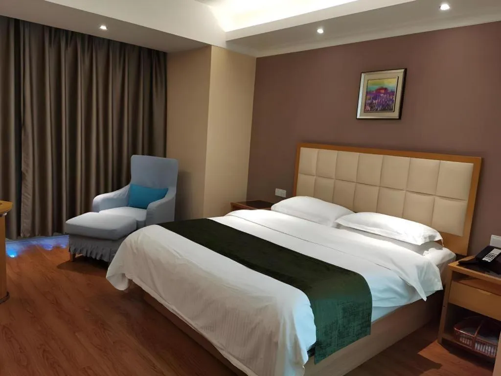 Bed in GreenTree Inn Shandong Taian Feicheng Xincheng Road Business Hotel