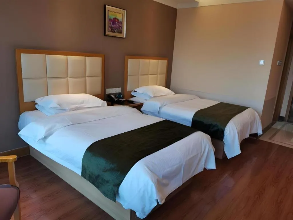 Bed in GreenTree Inn Shandong Taian Feicheng Xincheng Road Business Hotel
