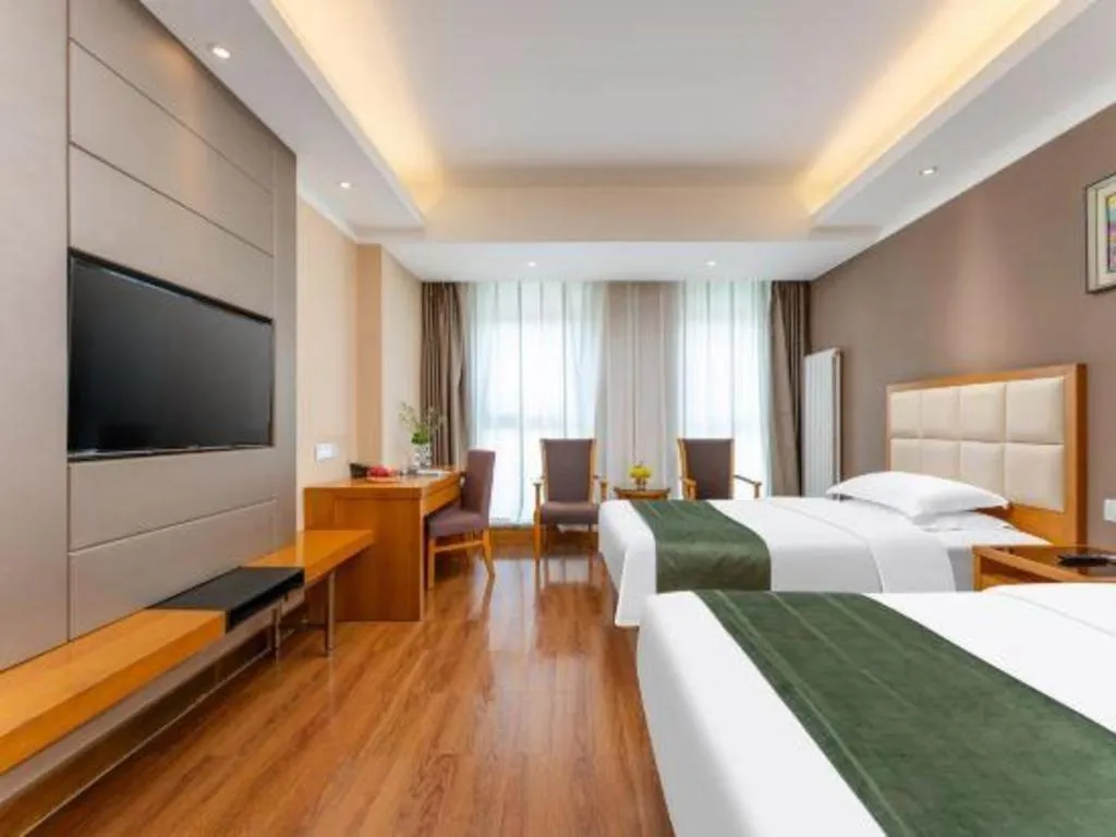 Bed in GreenTree Inn Shandong Taian Feicheng Xincheng Road Business Hotel