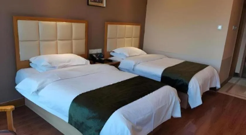 Bed in GreenTree Inn Shandong Taian Feicheng Xincheng Road Business Hotel