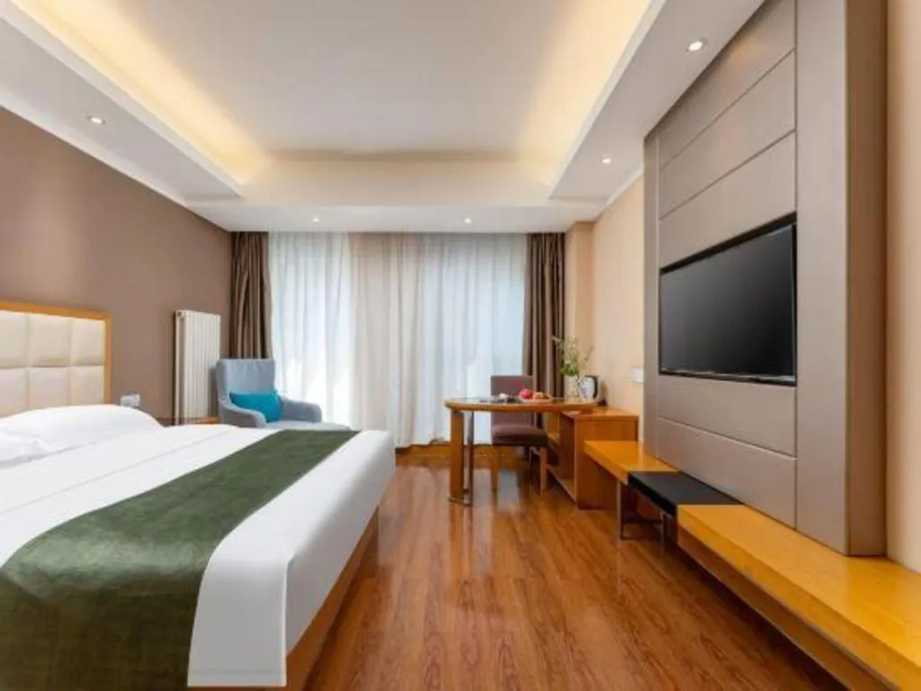 Bed in GreenTree Inn Shandong Taian Feicheng Xincheng Road Business Hotel