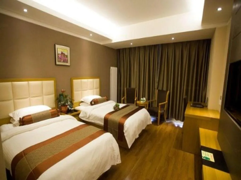 Bed in GreenTree Inn Shandong Taian Feicheng Xincheng Road Business Hotel