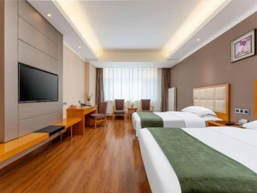 Bed in GreenTree Inn Shandong Taian Feicheng Xincheng Road Business Hotel