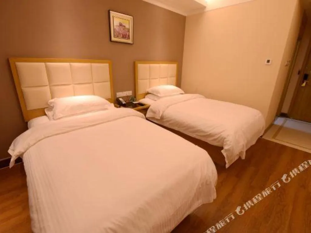 Bed in GreenTree Inn Shandong Taian Feicheng Xincheng Road Business Hotel