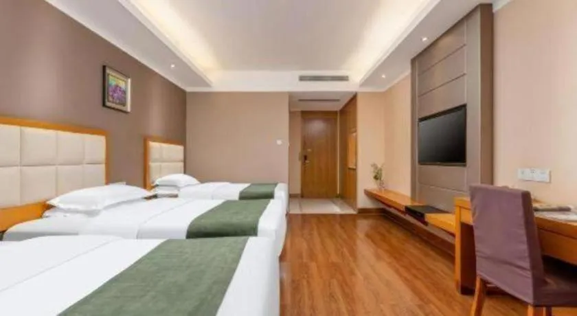 Bed in GreenTree Inn Shandong Taian Feicheng Xincheng Road Business Hotel