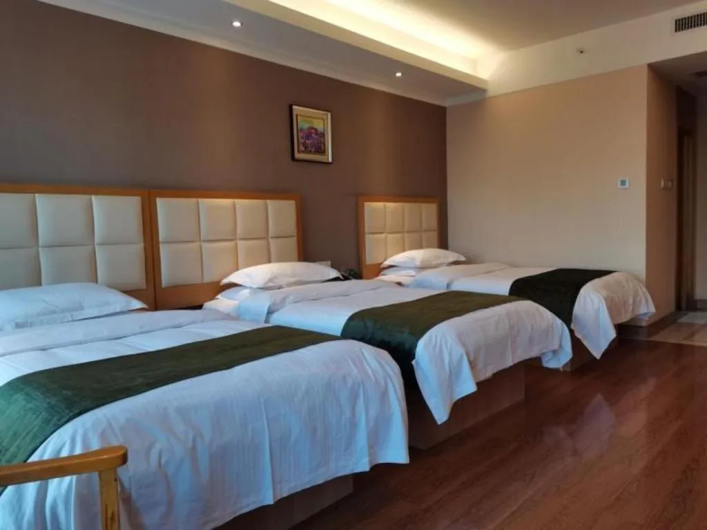 Bed in GreenTree Inn Shandong Taian Feicheng Xincheng Road Business Hotel
