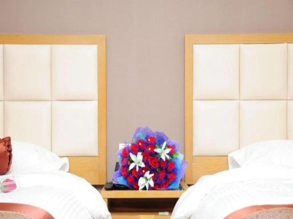 Bed in GreenTree Inn Shandong Taian Feicheng Xincheng Road Business Hotel