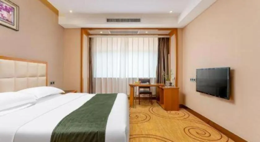 Bed in GreenTree Inn Shandong Taian Feicheng Xincheng Road Business Hotel