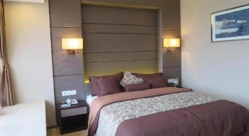 Bed in FOGER YACHT HOTEL