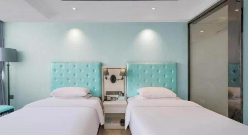 Bed in Qingdao Galaxy Holiday Hotel