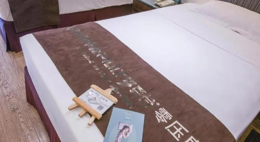 Bed in Tianjin Juchuan Lily Hotel