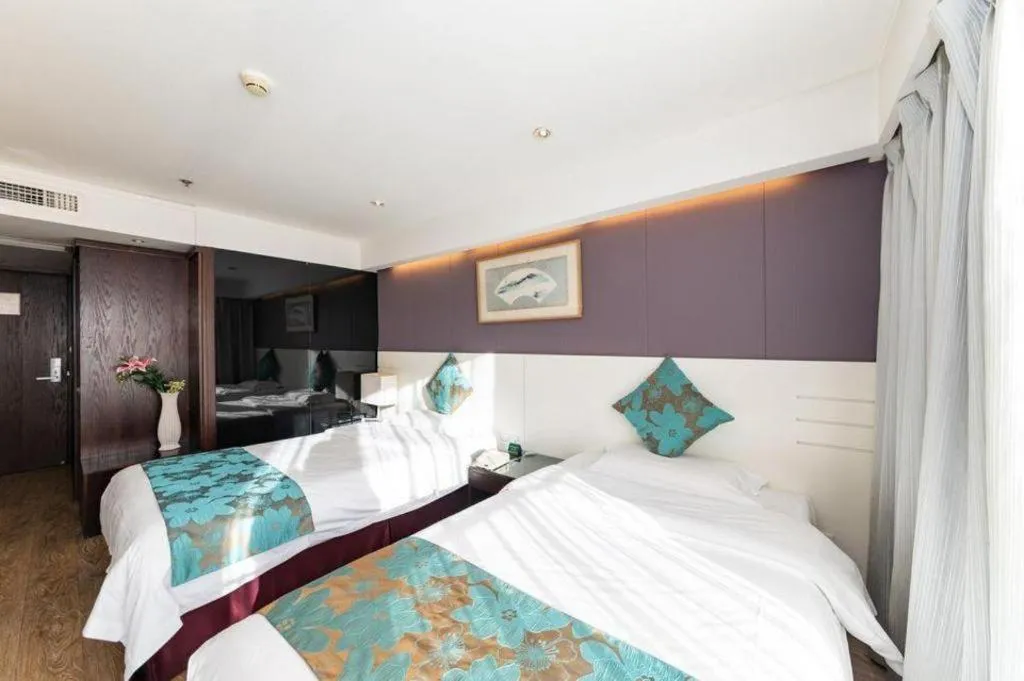 Bed in Tianjin Juchuan Lily Hotel