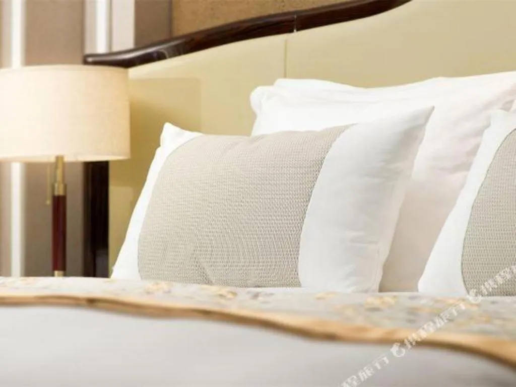Bed in Grand Bay Hotel Beijing
