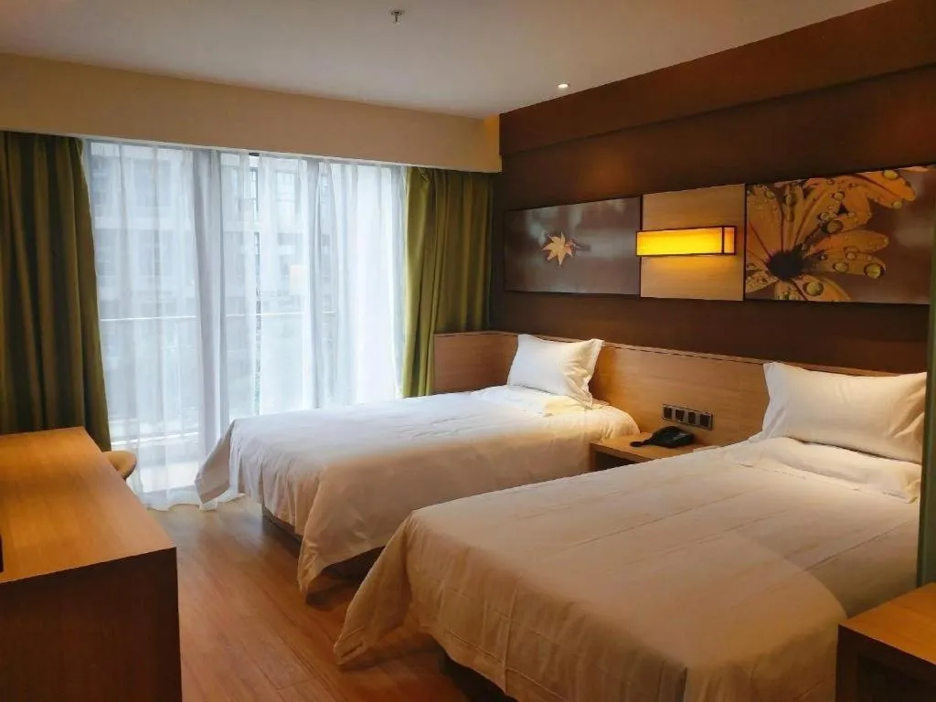 Bed in IU Hotel Tianjin Youyi Road Meijiang Exhibition Meiniu Metro Station