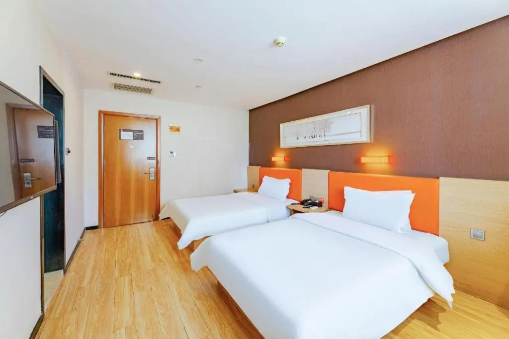 Bed in IU Hotel Tianjin Youyi Road Meijiang Exhibition Meiniu Metro Station