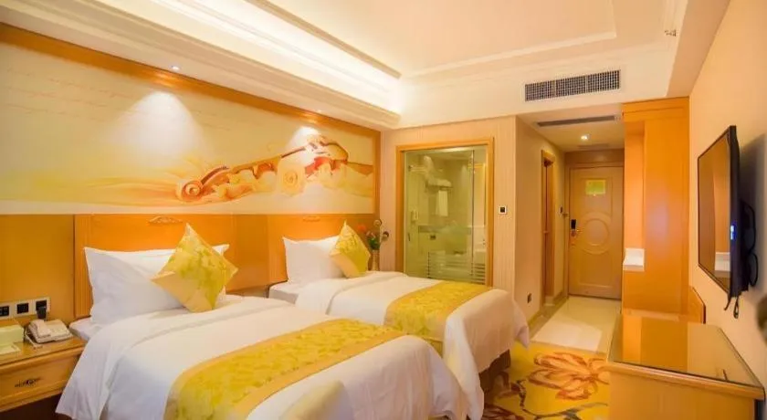 Bed in Vienna Hotel Guangxi Liuzhou Xijiang Vientiane City