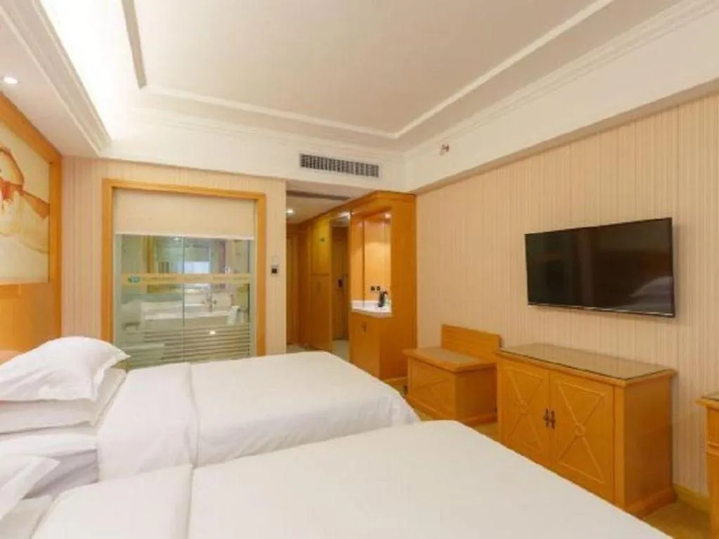 Bed in Vienna Hotel Guangxi Liuzhou Xijiang Vientiane City