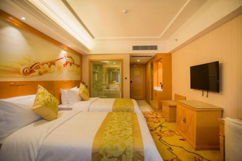 Bed in Vienna Hotel Guangxi Liuzhou Xijiang Vientiane City