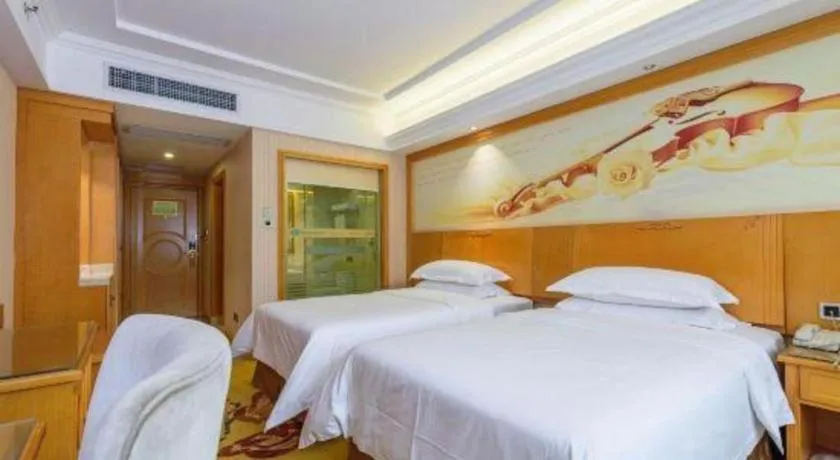 Bed in Vienna Hotel Guangxi Liuzhou Xijiang Vientiane City