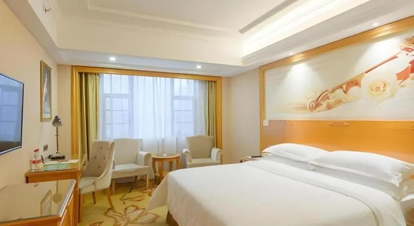 Bed in Vienna Hotel Guangxi Liuzhou Xijiang Vientiane City