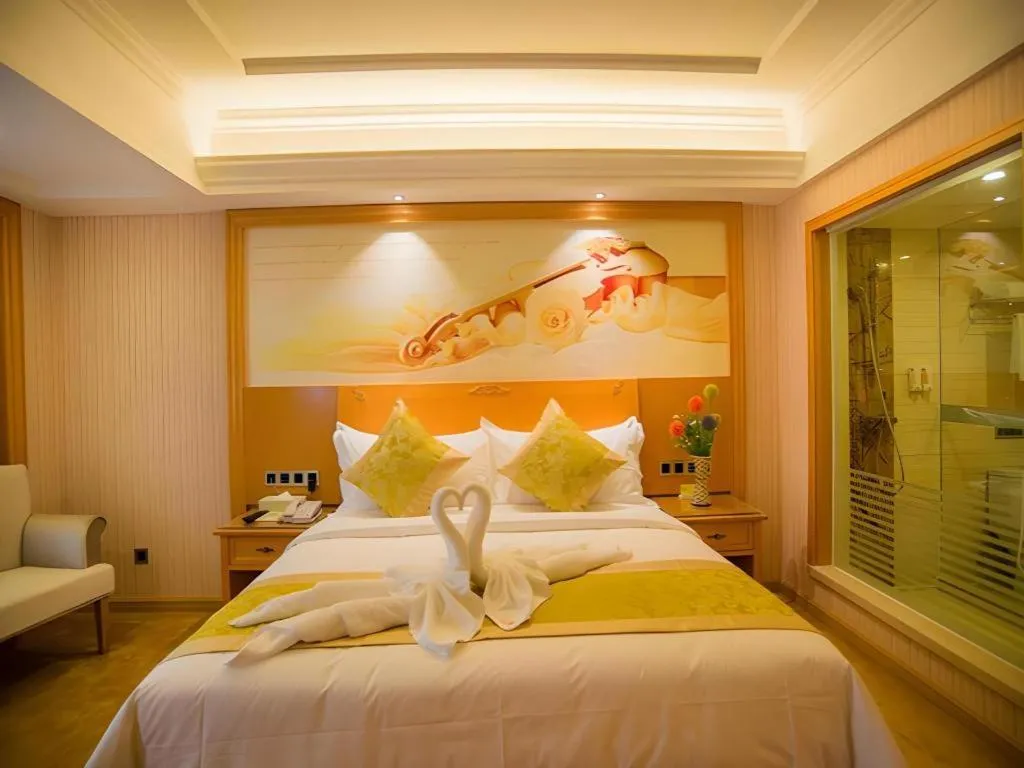 Bed in Vienna Hotel Guangxi Liuzhou Xijiang Vientiane City