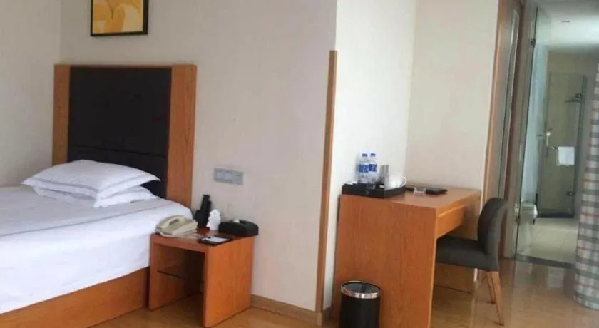 Bed in Warmly Hotel Suzhou Shuanghuwan