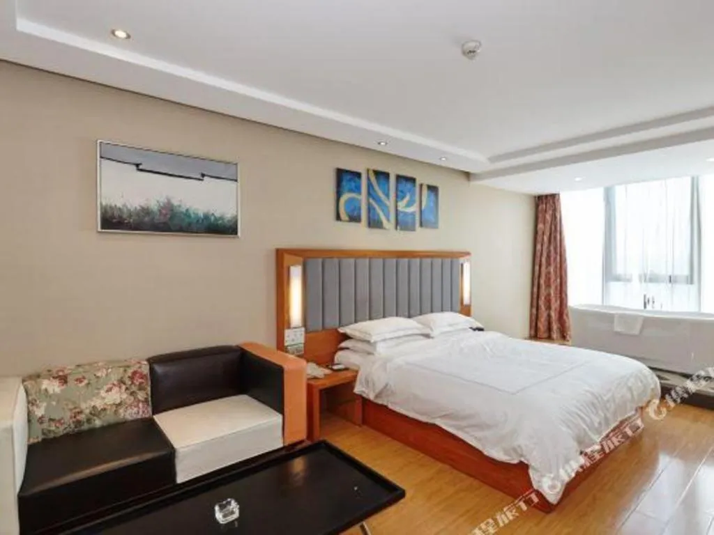 Bed in Warmly Hotel Suzhou Shuanghuwan