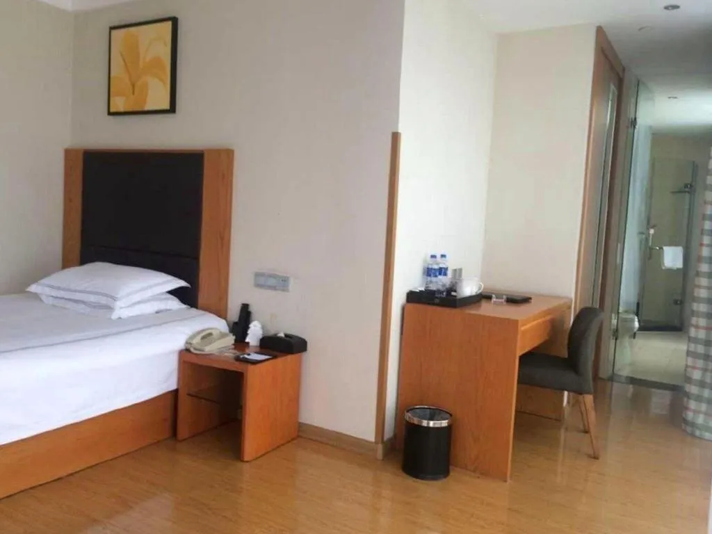 Bed in Warmly Hotel Suzhou Shuanghuwan