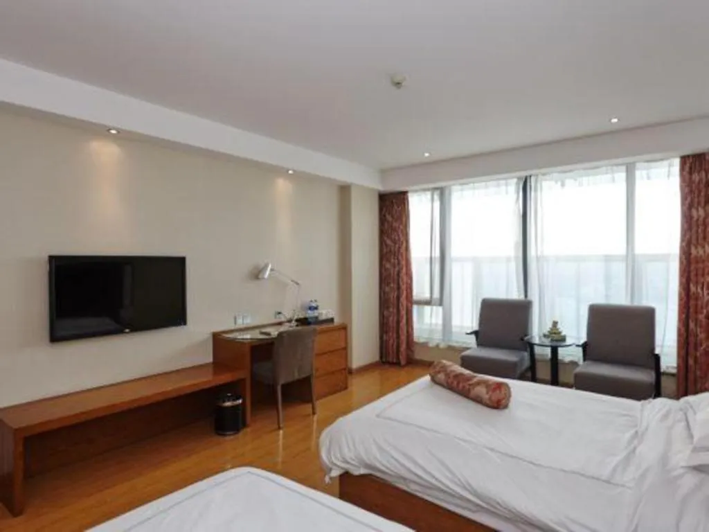 Bed in Warmly Hotel Suzhou Shuanghuwan