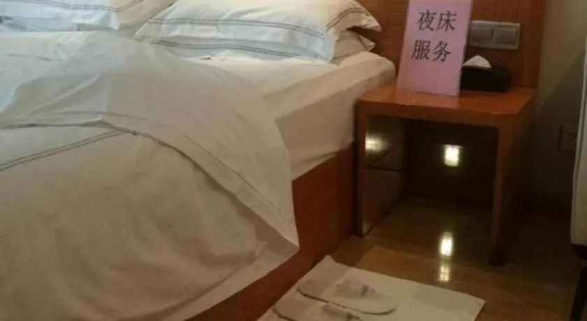 Bed in Warmly Hotel Suzhou Shuanghuwan