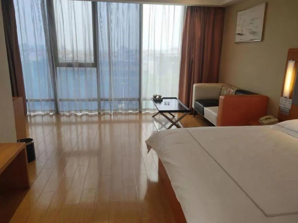 Bed in Warmly Hotel Suzhou Shuanghuwan