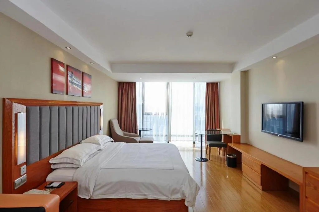 Bed in Warmly Hotel Suzhou Shuanghuwan