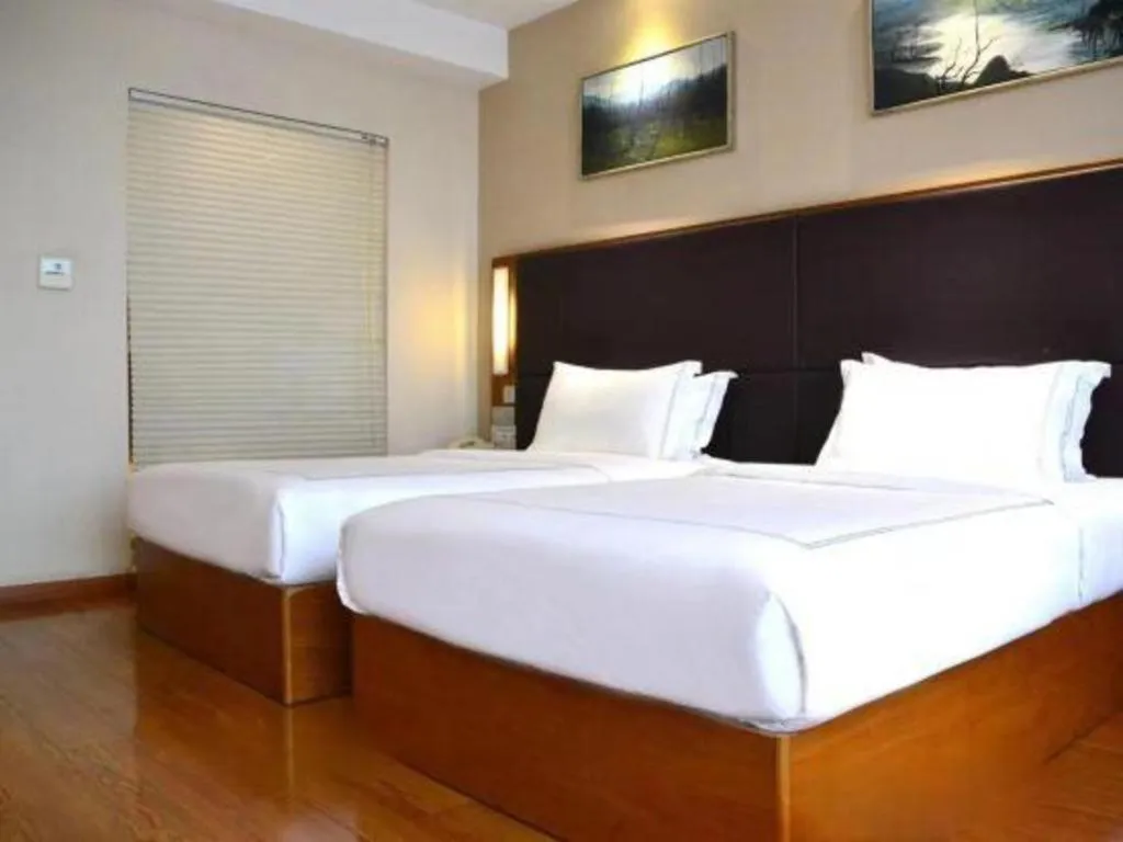 Bed in Warmly Hotel Suzhou Shuanghuwan