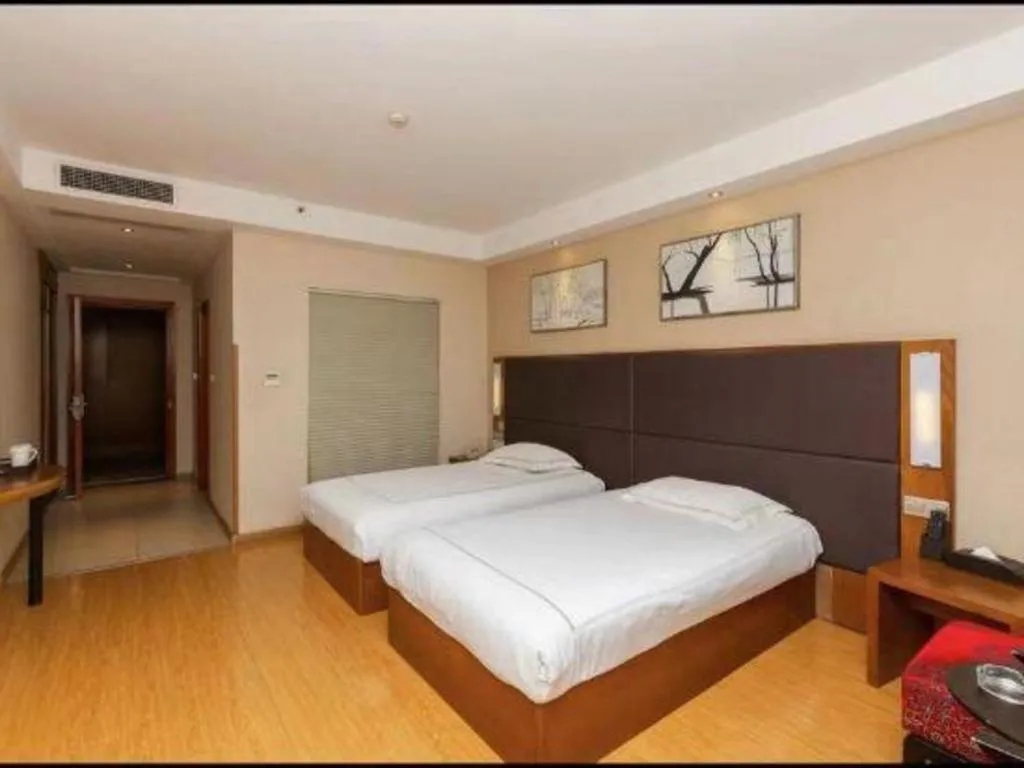 Bed in Warmly Hotel Suzhou Shuanghuwan