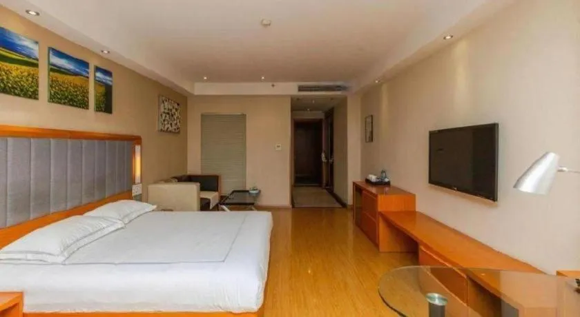 Bed in Warmly Hotel Suzhou Shuanghuwan