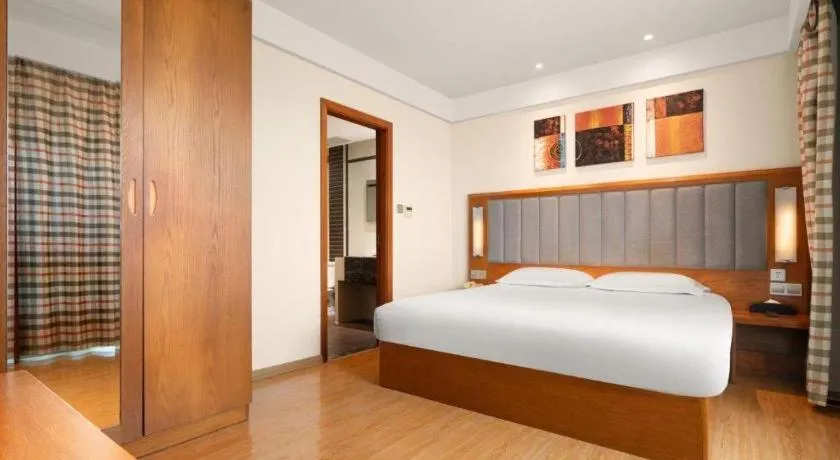 Bed in Warmly Hotel Suzhou Shuanghuwan