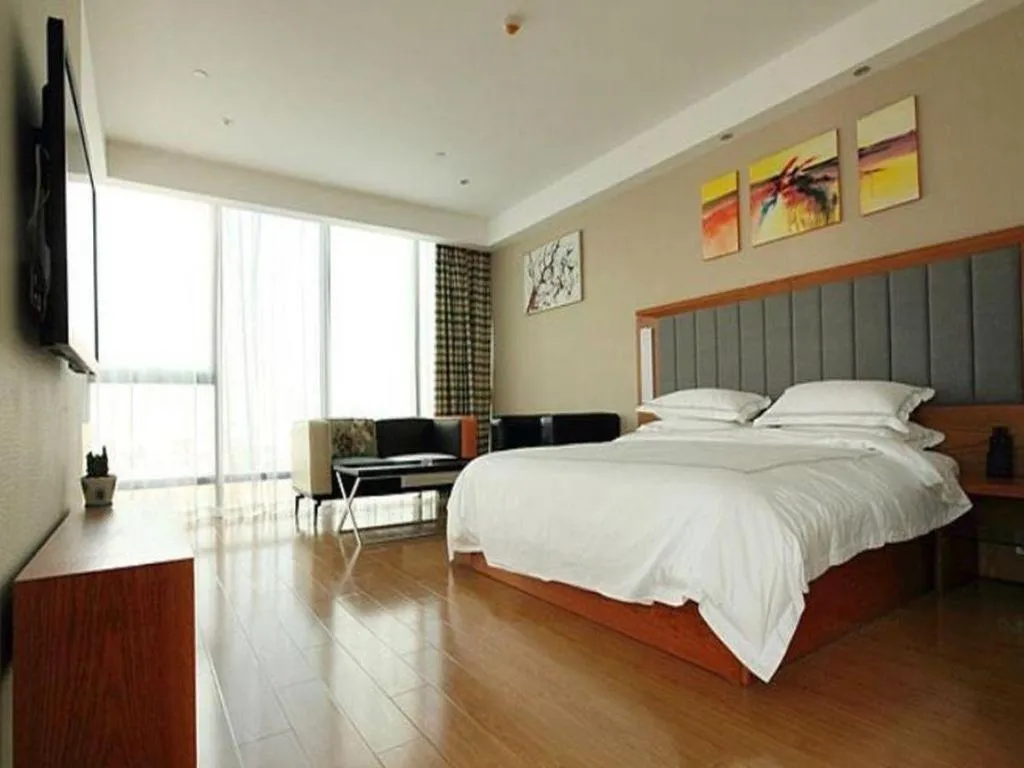 Bed in Warmly Hotel Suzhou Shuanghuwan