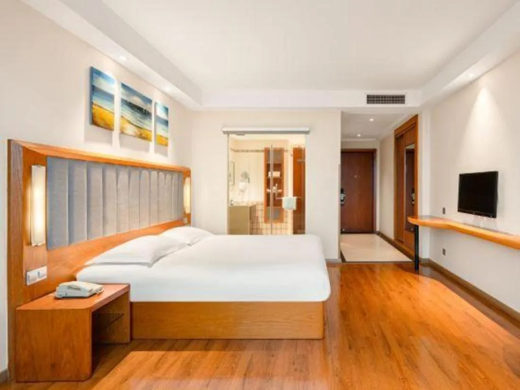 Bed in Warmly Hotel Suzhou Shuanghuwan