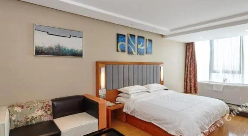 Bed in Warmly Hotel Suzhou Shuanghuwan