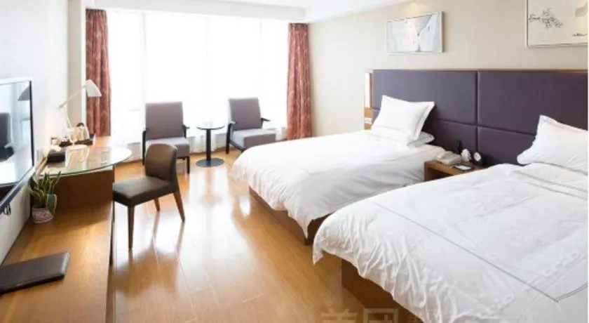 Bed in Warmly Hotel Suzhou Shuanghuwan