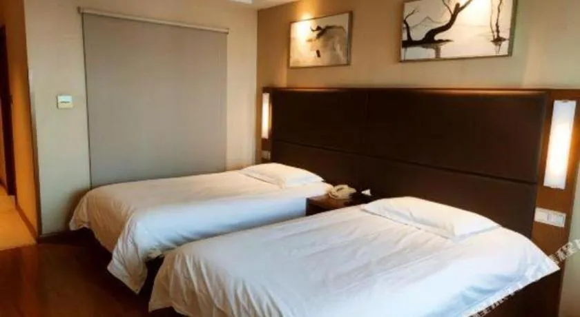 Bed in Warmly Hotel Suzhou Shuanghuwan