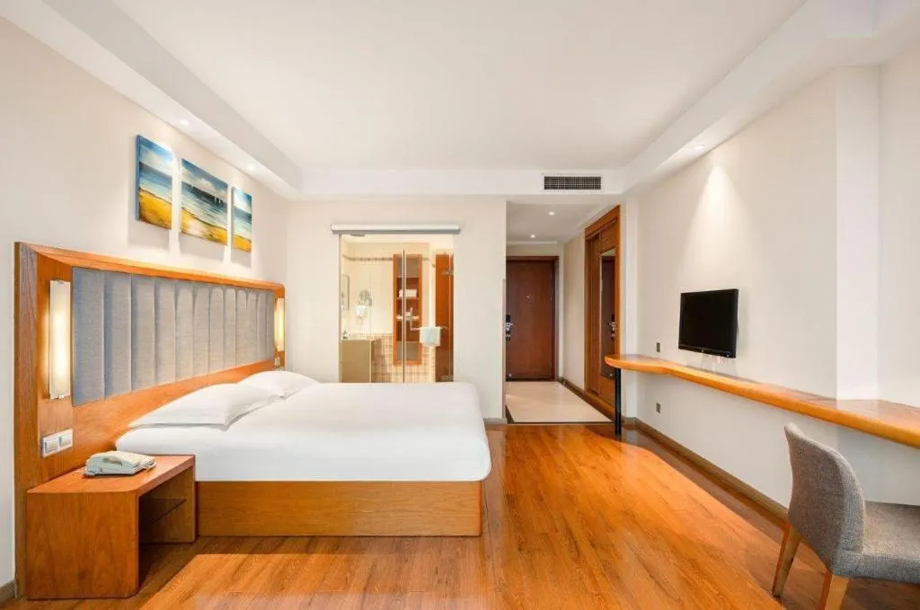 Bed in Warmly Hotel Suzhou Shuanghuwan