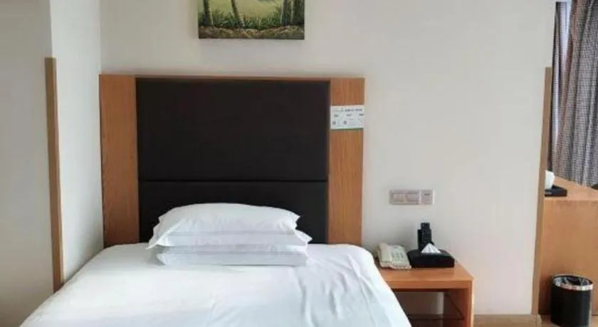 Bed in Warmly Hotel Suzhou Shuanghuwan