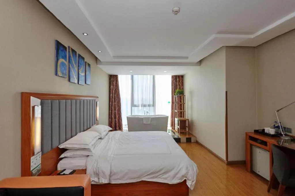 Bed in Warmly Hotel Suzhou Shuanghuwan