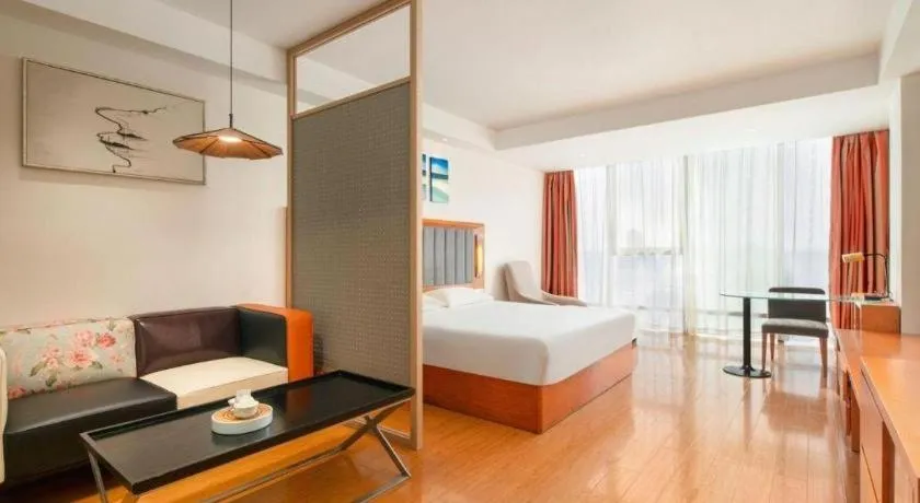 Bed in Warmly Hotel Suzhou Shuanghuwan