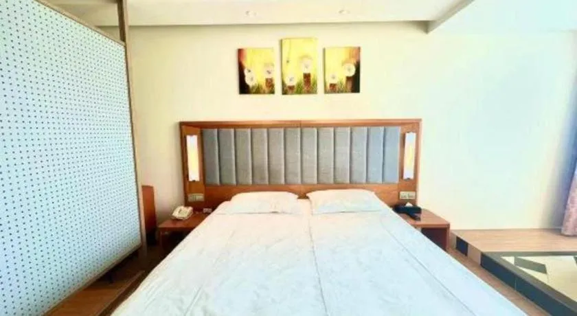 Bed in Warmly Hotel Suzhou Shuanghuwan